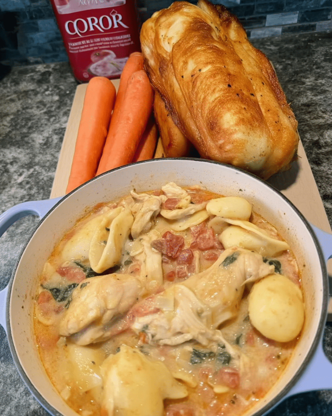 Creamy chicken and spinach soup in white ceramic bowl
