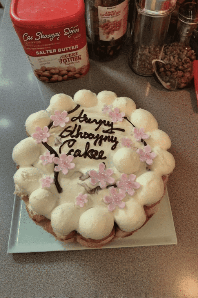 Close-up of cherry blossom cake slice with almond layers