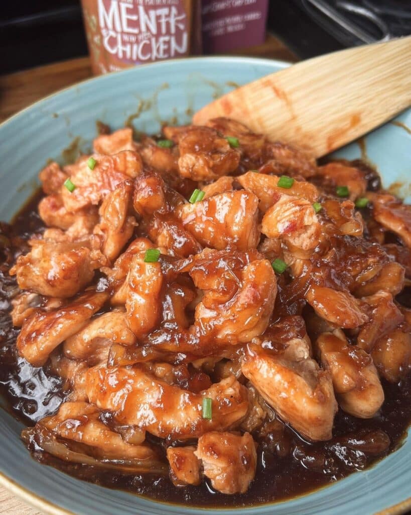 Easy Crock Pot Bourbon Chicken recipe! Juicy chicken thighs simmered in a sweet and savory bourbon sauce. Perfect for a weeknight dinner or meal prep! Get the recipe for this delicious crockpot chicken now.
