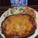 Cheesy Buffalo Chicken Dip: A creamy, spicy, and irresistible appetizer perfect for game day or any gathering! This easy recipe combines shredded chicken, cream cheese, buffalo sauce, and cheddar cheese for a flavorful dip served with Fritos, baguette slices, or veggies. #buffalochickendip #gamedayfood #appetizer #easyrecipe #chicken