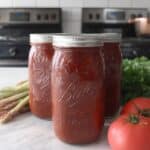 Home canning spaghetti sauce in glass mason jars