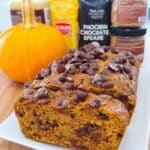 chocolate chip pumpkin bread sliced on wooden board