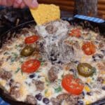 Irresistible Cowboy Queso Dip! Creamy, cheesy, and loaded with ground beef, Rotel, black beans, and spices. The ultimate appetizer recipe for parties and game day! Get the recipe now!
