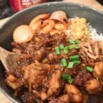 Easy Crock Pot Bourbon Chicken recipe! Juicy chicken thighs simmered in a sweet and savory bourbon sauce. Perfect for a weeknight dinner or meal prep! Get the recipe for this delicious crockpot chicken now.
