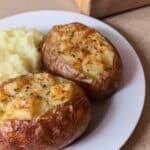 Crockpot side dishes featuring foil-wrapped baked potato