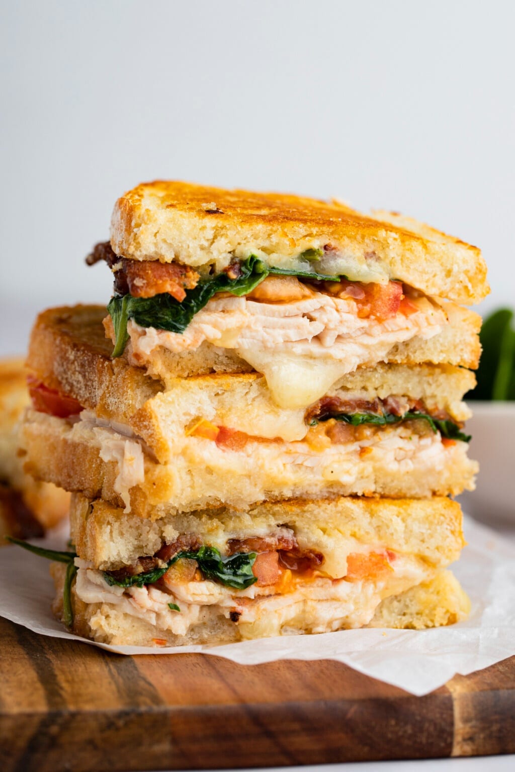 Close-up of cheesy turkey melt with bacon and honey mustard – fall dinner ideas