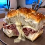 Meat and Cheese Sliders: Easy tailgate and party food! Delicious ham and Swiss sliders baked with a savory butter sauce. Perfect appetizer or Super Bowl snack!
