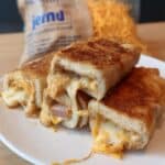 Easy grilled cheese roll-ups recipe! Perfect kids lunch idea for school or daycare. Quick, picky-eater approved meal with simple ingredients. #kidslunchideas #grilledcheese #schoollunch