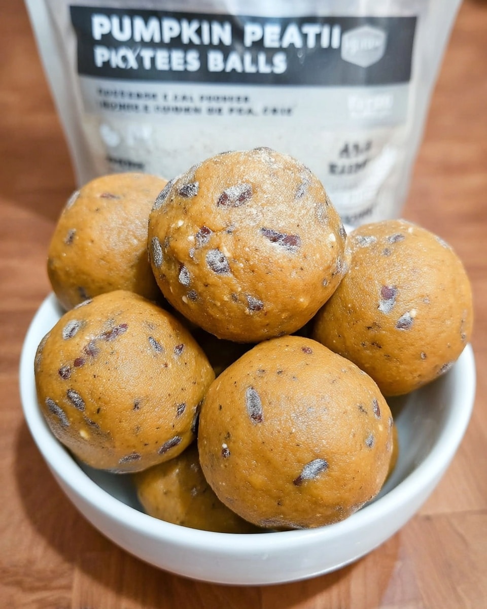 Close-up of pumpkin protein balls with visible spice and nut butter