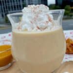 Homemade pumpkin coffee creamer in glass jar with cinnamon sticks