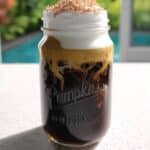 Pumpkin Cream Cold Foam in glass over iced coffee