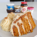 Pumpkin spice cake with brown butter frosting on a plate
