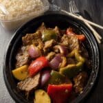 Slow Cooker Pepper Steak: A flavorful and easy dump-and-go recipe with beef, colorful peppers, and onions in a Chinese-inspired sauce. Perfect served over rice or noodles for a comforting dinner.