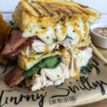 Turkey melt sandwich on plate with cheddar and spinach – fall dinner ideas