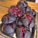 Perfectly cut Brimstone Brownies on a Halloween-themed plate.