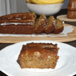 A plate of Easy Pumpkin Brownies served with a scoop of vanilla ice cream and a drizzle of caramel sauce.