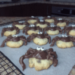 Close-up of Peanut Butter Spider Cookies on a baking sheet.