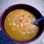 Bowl of pumpkin soup with drizzle of pumpkin spice syrup